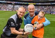 11 August 2018; GAA legend and former Dublin goalkeeper John O'Leary who walked onto the pitch with his son Tom, age 7, who presented the ball to the referee, Barry Cassidy, on behalf of the Jack & Jill Children's Foundation at Croke Park in Dublin. Tom, who has a very rare condition, has been supported by Jack & Jill home nursing care and John is a board member and ambassador for the charity. Photo by Ray McManus/Sportsfile