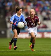 11 August 2018; Saoirse Martin, St Mary’s PS, Newtownbutler, Fermanagh, representing Dublin, in action against Gracie Crimmins, St Brigid’s PS Drumilly, Down, representing Galway,  during the INTO Cumann na mBunscol GAA Respect Exhibition Go Games at the GAA Football All-Ireland Senior Championship Semi Final match between Dublin and Galway at Croke Park in Dublin. Photo by Ray McManus/Sportsfile
