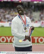 31 August 2003; Dwain Chambers of the Great Britain with a Gold medal belonging to one of the USA team and his own Silver medal after the presentation ceremony for the Men's 4 X 100m during the ninth day's competition at the 9th IAAF World Championships in Athletics at the Stade de France in Paris, France. Photo by Brendan Moran/Sportsfile