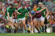 19 August 2018; Johnny Coen of Galway in action against Limerick players, from left, Declan Hannon, Darragh O'Donovan and Cian Lynch during the GAA Hurling All-Ireland Senior Championship Final match between Galway and Limerick at Croke Park in Dublin.  Photo by Piaras Ó Mídheach/Sportsfile