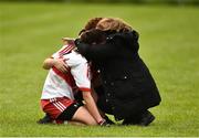 26 August 2018; Danielle Kivlehan of Derry dejected, being comforted by a supporter after the TG4 All-Ireland Junior Championship Semi Final match between Derry and Louth at Aghaloo O'Neills in Aughnacloy, Co. Tyrone. Photo by Oliver McVeigh/Sportsfile