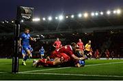 8 September 2018; Fergus McFadden of Leinster goes over to score his side's first try despite the tackle of Leigh Halfpenny, and Rob Evans, left, of Scarlets during the Guinness PRO14 Round 2 match between Scarlets and Leinster at Parc y Scarlets in Llanelli, Wales. Photo by Stephen McCarthy/Sportsfile