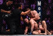 6 October 2018; Referee Herb Dean stops the fight between Conor McGregor and Khabib Nurmagomedov in the fourth round of their UFC lightweight championship fight during UFC 229 at T-Mobile Arena in Las Vegas, Nevada, USA. Photo by Stephen McCarthy/Sportsfile