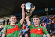 14 October 2018; St.Brigid's captains Ciaran Sugrue, left, and Paul McGrath lift the cup after the Roscommon County Minor Club Football Championship Final match between Castlerea St. Kevin's and St Brigid's at Dr Hyde Park, Roscommon. Photo by Barry Cregg/Sportsfile