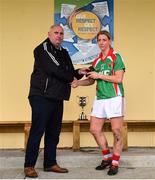 21 October 2018; Mayo Ladies' County Board secretary Kevin McDonnell presents the player of the match award to Cora Staunton of Carnacon following the Mayo County Senior Club Ladies Football Final match between Carnacon and Knockmore at Kilmeena GAA Club in Mayo. Photo by David Fitzgerald/Sportsfile