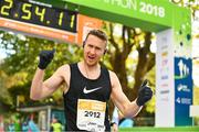 28 October 2018; Sean Doyle, from Naas, Co. Kildare, celebrates crossing the finish line during the 2018 SSE Airtricity Dublin Marathon. 20,000 runners took to the Fitzwilliam Square start line to participate in the 39th running of the SSE Airtricity Dublin Marathon, making it the fifth largest marathon in Europe. Photo by Ramsey Cardy/Sportsfile