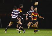 23 November 2018; Tom Roche of Lansdowne is tackled by Harry Moore, 11, and Matt Byrne of Terenure College as he gets his pass away to teammate Harry Brennan during the Ulster Bank League Division 1A match between Lansdowne and Terenure College at Aviva Stadium in Dublin.  Photo by Ben McShane/Sportsfile