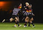 23 November 2018; Tom Roche of Lansdowne is tackled by Harry Moore, 11, and Matt Byrne of Terenure College as he gets his pass away to teammate Harry Brennan during the Ulster Bank League Division 1A match between Lansdowne and Terenure College at Aviva Stadium in Dublin.  Photo by Ben McShane/Sportsfile