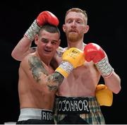 7 December 2018; Niall O'Connor, right, and Krzysztof Rogowski following their lightweight contest at The Royal Theatre in Castlebar, Mayo. Photo by Stephen McCarthy/Sportsfile