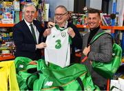 12 December 2018; FAI CEO John Delaney, left, along with Republic of Ireland Women’s National Team manager Colin Bell, right, were on hand today to hand over Ireland bags filled with jerseys, footballs, scarfs & other merchandise to Liam Casey, centre, East Region President, St Vincent De Paul, at the St Vincent De Paul depot on Sean McDermott Street, Dublin. The gifts are part of an annual Christmas donation for families in need. Photo by Seb Daly/Sportsfile