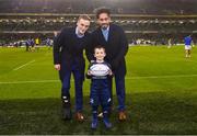 15 December 2018; Matchday mascot 5 year old Conor Ó Buachalla, from Kilmacud, Dublin, with Leinster players Nick mcCarthy and Joe Tomane ahead of the European Rugby Champions Cup Pool 1 Round 4 match between Leinster and Bath at the Aviva Stadium in Dublin. Photo by Ramsey Cardy/Sportsfile