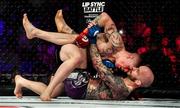 23 February 2019; Paul Redmond, left, in action against Charlie Leary in their Lightweight bout during Bellator 217 at the 3 Arena in Dublin. Photo by David Fitzgerald/Sportsfile