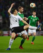 21 March 2019; Artur Pikk of Estonia in action against Niall McGinn of Northern Ireland during the UEFA EURO2020 Qualifier - Group C match between Northern Ireland and Estonia at National Football Stadium in Windsor Park, Belfast.  Photo by David Fitzgerald/Sportsfile