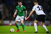 21 March 2019; Stuart Dallas of Northern Ireland in action against Karol Mets of Estonia during the UEFA EURO2020 Qualifier - Group C match between Northern Ireland and Estonia at National Football Stadium in Windsor Park, Belfast.  Photo by David Fitzgerald/Sportsfile