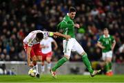 24 March 2019; Alyaksandr Martynovich of Belarus in action against Kyle Lafferty of Northern Ireland during the UEFA EURO2020 Qualifier Group C match between Northern Ireland and Belarus at the National Football Stadium in Windsor Park, Belfast. Photo by Ramsey Cardy/Sportsfile