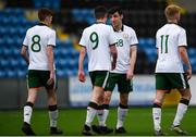 25 March 2019; Simon Falvey of Colleges & Universities, second right, celebrates after scoring his side's fourth goal with team-mates during the match between Colleges & Universities and Defence Forces at  Athlone Town Stadium in Athlone, Co. Westmeath. Photo by Harry Murphy/Sportsfile