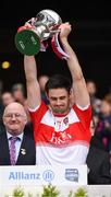 30 March 2019; Derry captain Christopher McKaigue lifts the cup after the Allianz Football League Division 4 Final between Derry and Leitrim at Croke Park in Dublin. Photo by Ray McManus/Sportsfile