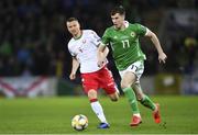 24 March 2019; Paddy McNair of Northern Ireland in action against Igor Shitov of Belarus during the UEFA EURO2020 Qualifier Group C match between Northern Ireland and Belarus at the National Football Stadium in Windsor Park, Belfast. Photo by Ramsey Cardy/Sportsfile