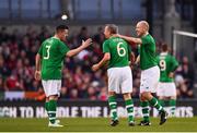 12 April 2019; Ronnie Whelan of Republic of Ireland XI is congratulated by Ian Harte, left, and Kenny Cunningham, right, after being substituted during the Sean Cox Fundraiser match between the Republic of Ireland XI and Liverpool FC Legends at the Aviva Stadium in Dublin. Photo by Sam Barnes/Sportsfile