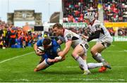 27 April 2019; Fergus McFadden of Leinster dives over to score his side's second try despite the tackle of Darren Cave, left, and Michael Lowry of Ulster during the Guinness PRO14 Round 21 match between Ulster and Leinster at the Kingspan Stadium in Belfast. Photo by Ramsey Cardy/Sportsfile