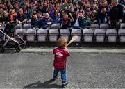 26 May 2019; Two-year-old Tommy Joyce, from Loughrea, Galway, takes in the applause from the crowd prior to the Leinster GAA Hurling Senior Championship Round 3A match between Galway and Wexford at Pearse Stadium in Galway. Photo by Stephen McCarthy/Sportsfile