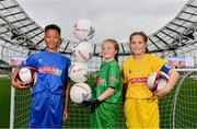 29 May 2019; The SPAR FAI Primary School 5s National Finals took place in AVIVA Stadium on Wednesday, May 29, where former Republic of Ireland International Keith Andrews and current Republic of Ireland women's footballer, Megan Campbell were in attendance supporting as girls and boys from 13 counties battled it out for national honours. The 2019 SPAR FAI Primary School 5s Programme was the biggest yet with a record 37,448 participants from 1,696 schools taking part in county, regional and provincial blitzes nationwide. Pictured are, from left, Declan Osagie, aged 13, from Offaly, Ellie Browne, aged 13, from Galway,  and Jodie Loughrey, aged 12, from Donegal, at the Aviva Stadium in Dublin.   Photo by Sam Barnes/Sportsfile