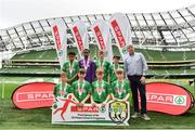 29 May 2019; The SPAR FAI Primary School 5s National Finals took place in AVIVA Stadium on Wednesday, May 29, where former Republic of Ireland International Keith Andrews and current Republic of Ireland women's footballer, Megan Campbell were in attendance supporting as girls and boys from 13 counties battled it out for national honours. The 2019 SPAR FAI Primary School 5s Programme was the biggest yet with a record 37,448 participants from 1,696 schools taking part in county, regional and provincial blitzes nationwide. Pictured is the Second St John The Apostle National School team, from Galway, with Tom Meehan, Spar Retailer, at the Aviva Stadium in Dublin.   Photo by Sam Barnes/Sportsfile