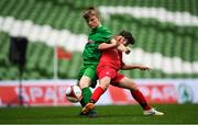 29 May 2019; The SPAR FAI Primary School 5s National Finals took place in AVIVA Stadium on Wednesday, May 29, where former Republic of Ireland International Keith Andrews and current Republic of Ireland women's footballer, Megan Campbell were in attendance supporting as girls and boys from 13 counties battled it out for national honours. The 2019 SPAR FAI Primary School 5s Programme was the biggest yet with a record 37,448 participants from 1,696 schools taking part in county, regional and provincial blitzes nationwide. Matthew Kiernan of Scoil Phádraig Naofa, Rochestown, Co. Cork, in action against Liam Murphy of St. John the Apostle NS, Kncknacarra, Co. Galway, at the Aviva Stadium in Dublin. Photo by Harry Murphy/Sportsfile