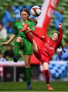 29 May 2019; The SPAR FAI Primary School 5s National Finals took place in AVIVA Stadium on Wednesday, May 29, where former Republic of Ireland International Keith Andrews and current Republic of Ireland women's footballer, Megan Campbell were in attendance supporting as girls and boys from 13 counties battled it out for national honours. The 2019 SPAR FAI Primary School 5s Programme was the biggest yet with a record 37,448 participants from 1,696 schools taking part in county, regional and provincial blitzes nationwide. Pictures is Alison Greaney if Clarinbridge NS, Co. Galway, in action against Fiana Bradley of Faha NS, Co. Kerry at the Aviva Stadium in Dublin. Photo by Harry Murphy/Sportsfile