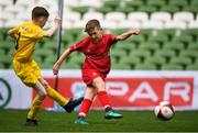 29 May 2019; The SPAR FAI Primary School 5s National Finals took place in AVIVA Stadium on Wednesday, May 29, where former Republic of Ireland International Keith Andrews and current Republic of Ireland women's footballer, Megan Campbell were in attendance supporting as girls and boys from 13 counties battled it out for national honours. The 2019 SPAR FAI Primary School 5s Programme was the biggest yet with a record 37,448 participants from 1,696 schools taking part in county, regional and provincial blitzes nationwide. Pictured is match action between Scoil Phádraig Naofa, Rochestown, Co. Cork, and St. John the Apostle NS, Knocknacarra, Co. Galway at the Aviva Stadium in Dublin.  Photo by Harry Murphy/Sportsfile