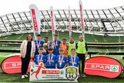 29 May 2019; The SPAR FAI Primary School 5s National Finals took place in AVIVA Stadium on Wednesday, May 29, where former Republic of Ireland International Keith Andrews and current Republic of Ireland women's footballer, Megan Campbell were in attendance supporting as girls and boys from 13 counties battled it out for national honours. The 2019 SPAR FAI Primary School 5s Programme was the biggest yet with a record 37,448 participants from 1,696 schools taking part in county, regional and provincial blitzes nationwide. Pictured are Section C Boys winners, Scoil Mhuire Banrion from Edenderry, Co. Offaly, with Helen Somerville, Spar, right, at the Aviva Stadium in Dublin.   Photo by Sam Barnes/Sportsfile