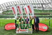 29 May 2019; The SPAR FAI Primary School 5s National Finals took place in AVIVA Stadium on Wednesday, May 29, where former Republic of Ireland International Keith Andrews and current Republic of Ireland women's footballer, Megan Campbell were in attendance supporting as girls and boys from 13 counties battled it out for national honours. The 2019 SPAR FAI Primary School 5s Programme was the biggest yet with a record 37,448 participants from 1,696 schools taking part in county, regional and provincial blitzes nationwide. Pictured are players and coaches from Schoil Mhuire Clarinbridge NS, Co Galway with Spar Representative John Caldwell. Photo by David Fitzgerald/Sportsfile