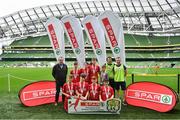 29 May 2019; The SPAR FAI Primary School 5s National Finals took place in AVIVA Stadium on Wednesday, May 29, where former Republic of Ireland International Keith Andrews and current Republic of Ireland women's footballer, Megan Campbell were in attendance supporting as girls and boys from 13 counties battled it out for national honours. The 2019 SPAR FAI Primary School 5s Programme was the biggest yet with a record 37,448 participants from 1,696 schools taking part in county, regional and provincial blitzes nationwide. Pictured are players and coaches from Lisnagry NS, Co Limerick with Spar Representative Hugh Sweeney. Photo by David Fitzgerald/Sportsfile