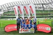 29 May 2019; The SPAR FAI Primary School 5s National Finals took place in AVIVA Stadium on Wednesday, May 29, where former Republic of Ireland International Keith Andrews and current Republic of Ireland women's footballer, Megan Campbell were in attendance supporting as girls and boys from 13 counties battled it out for national honours. The 2019 SPAR FAI Primary School 5s Programme was the biggest yet with a record 37,448 participants from 1,696 schools taking part in county, regional and provincial blitzes nationwide. Pictured are players and coaches from Gaelscoil Chill Mhantain, Co Wicklow with Spar Representative Louis Byrne. Photo by David Fitzgerald/Sportsfile