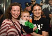 4 June 2019; Katie Taylor arrives back to Dublin Airport following her Undisputed Female World Lightweight Championship bout victory against Delfine Persoon at Madison Square Garden in New York, USA, on Saturday. Pictured is Undisputed World Lightweight Champion Katie Taylor poses for a photo with 10 month old Saoirse Spencer from Fairview, Co. Dublin and her mother Sinead Spencer at Dublin Airport in Dublin. Photo by Harry Murphy/Sportsfile