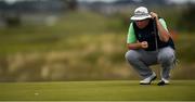 19 June 2019; Caolan Rafferty of Dundalk Golf Club, Co. Louth, Ireland, lines up a putt on the 11th green during day 3 of the R&A Amateur Championship at Portmarnock Golf Club in Dublin. Photo by Harry Murphy/Sportsfile