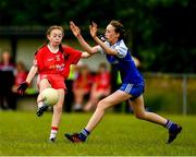 22 June 2019; Ciara Quinn of Tyrone in action against Niamh Flanagan of Monaghan  during the Ladies Football All-Ireland U14 Gold Final 2019 match between Monaghan and Tyrone at St Aidan's GAA Club in Templeport, Cavan. Photo by Ray McManus/Sportsfile