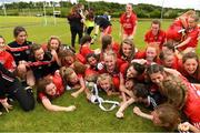 22 June 2019; The Tyrone captain Poppy Fox and her team-mates celebrate with the cup after the Ladies Football All-Ireland U14 Gold Final 2019 match between Monaghan and Tyrone at St Aidan's GAA Club in Templeport, Cavan. Photo by Ray McManus/Sportsfile