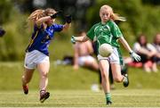 22 June 2019; Caoimhe Smith of Limerick in action against Niamh Hayes of Tipperary during the Ladies Football All-Ireland U14 Silver Final 2019 match between Limerick and Tipperary at St Rynaghs in Banagher, Offaly. Photo by Ben McShane/Sportsfile