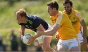 22 June 2019; Keith Cribbin of Kildare is tackled by Martin Johnston of Antrim during the GAA Football All-Ireland Senior Championship Round 2 match between Antrim and Kildare at Corrigan Park in Belfast, Antrim. Photo by Ramsey Cardy/Sportsfile