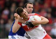 22 June 2019; Shane McGuigan of Derry is tackled by Gareth Dillon of Laois during the GAA Football All-Ireland Senior Championship Round 2 match between Derry and Laois at Derry GAA Centre of Excellence in Owenbeg, Derry. Photo by Ramsey Cardy/Sportsfile