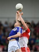 22 June 2019; Stephen Attride of Laois in action against Shane McGuigan of Derry during the GAA Football All-Ireland Senior Championship Round 2 match between Derry and Laois at Derry GAA Centre of Excellence in Owenbeg, Derry. Photo by Ramsey Cardy/Sportsfile