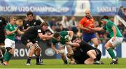 22 June 2019; Ronan Watters of Ireland, centre, is tackled during the World Rugby U20 Championship Pool B match between New Zealand and Ireland at Club Old Resian in Rosario, Argentina. Photo by Florencia Tan Jun/Sportsfile