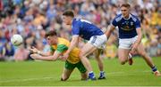 23 June 2019; Niall O’Donnell  of Donegal in action against Oisin Kiernan of Cavan during the Ulster GAA Football Senior Championship Final match between Donegal and Cavan at St Tiernach's Park in Clones, Monaghan. Photo by Oliver McVeigh/Sportsfile
