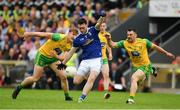 23 June 2019; Conor Rehill of Cavan in action against Paddy McGrath, right, and Hugh McFadden of Donegal during the Ulster GAA Football Senior Championship Final match between Donegal and Cavan at St Tiernach's Park in Clones, Monaghan. Photo by Sam Barnes/Sportsfile