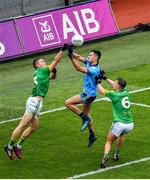 23 June 2019; Conor McGill of Meath punches the ball clear of team-mate Ronan Ryan and Niall Scully of Dublin during the Leinster GAA Football Senior Championship Final match between Dublin and Meath at Croke Park in Dublin. Photo by Brendan Moran/Sportsfile