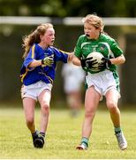 22 June 2019; Orla Ryan of Limerick in action against Ava Ryan of Tipperary during the Ladies Football All-Ireland U14 Silver Final 2019 match between Limerick and Tipperary at St Rynaghs in Banagher, Offaly. Photo by Ben McShane/Sportsfile