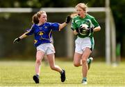 22 June 2019; Orla Ryan of Limerick in action against Ava Ryan of Tipperary during the Ladies Football All-Ireland U14 Silver Final 2019 match between Limerick and Tipperary at St Rynaghs in Banagher, Offaly. Photo by Ben McShane/Sportsfile
