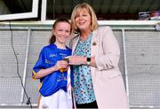 22 June 2019; Tipperary captain Ava Ryan is presented with the runners-up medal by LGFA President Marie Hickey following the Ladies Football All-Ireland U14 Silver Final 2019 match between Limerick and Tipperary at St Rynaghs in Banagher, Offaly. Photo by Ben McShane/Sportsfile