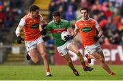 29 June 2019; Chris Barrett of Mayo in action against Niall Grimley, left, and Jarlath Óg Burns of Armagh during the GAA Football All-Ireland Senior Championship Round 3 match between Mayo and Armagh at Elverys MacHale Park in Castlebar, Mayo. Photo by Ben McShane/Sportsfile